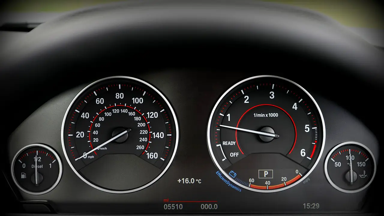 bmw car dashboard showing rpm and mph gauges
