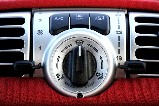 close up of a car's air conditioning vent and buttons