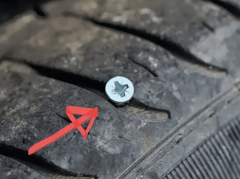 Screw between tire treads